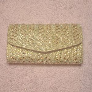Womens gold clutch with rhinestone design
